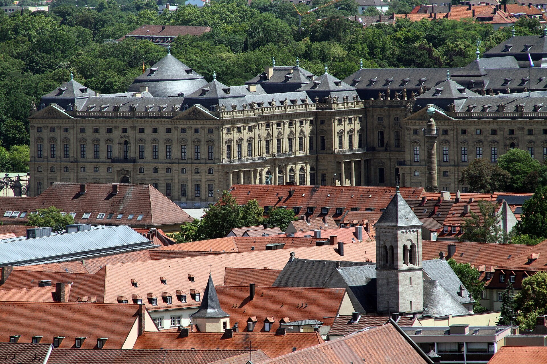 The baroque Würzburg Residence palace seen above the red roofs of the old town